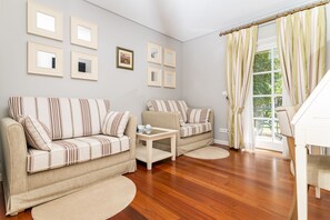 Suite, Pool View (Spa Access) | Living area | 30-cm LCD TV with cable channels, TV, heated floors