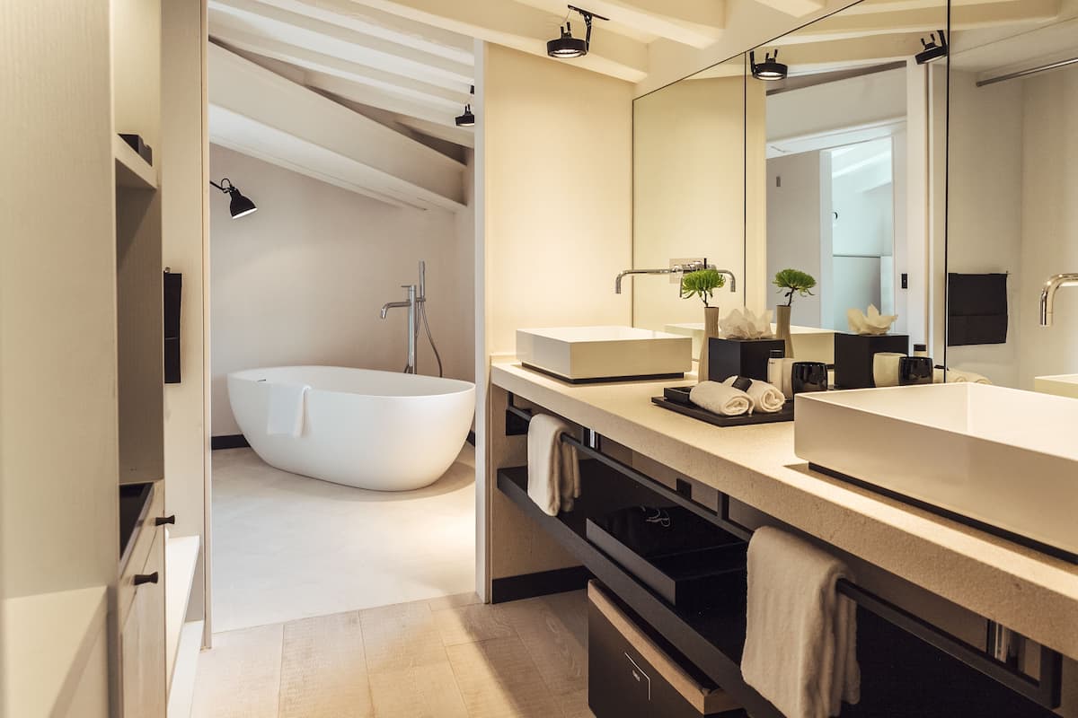 junior suite (singular) | bathroom | designer toiletries, hair dryer, bathrobes, slippers