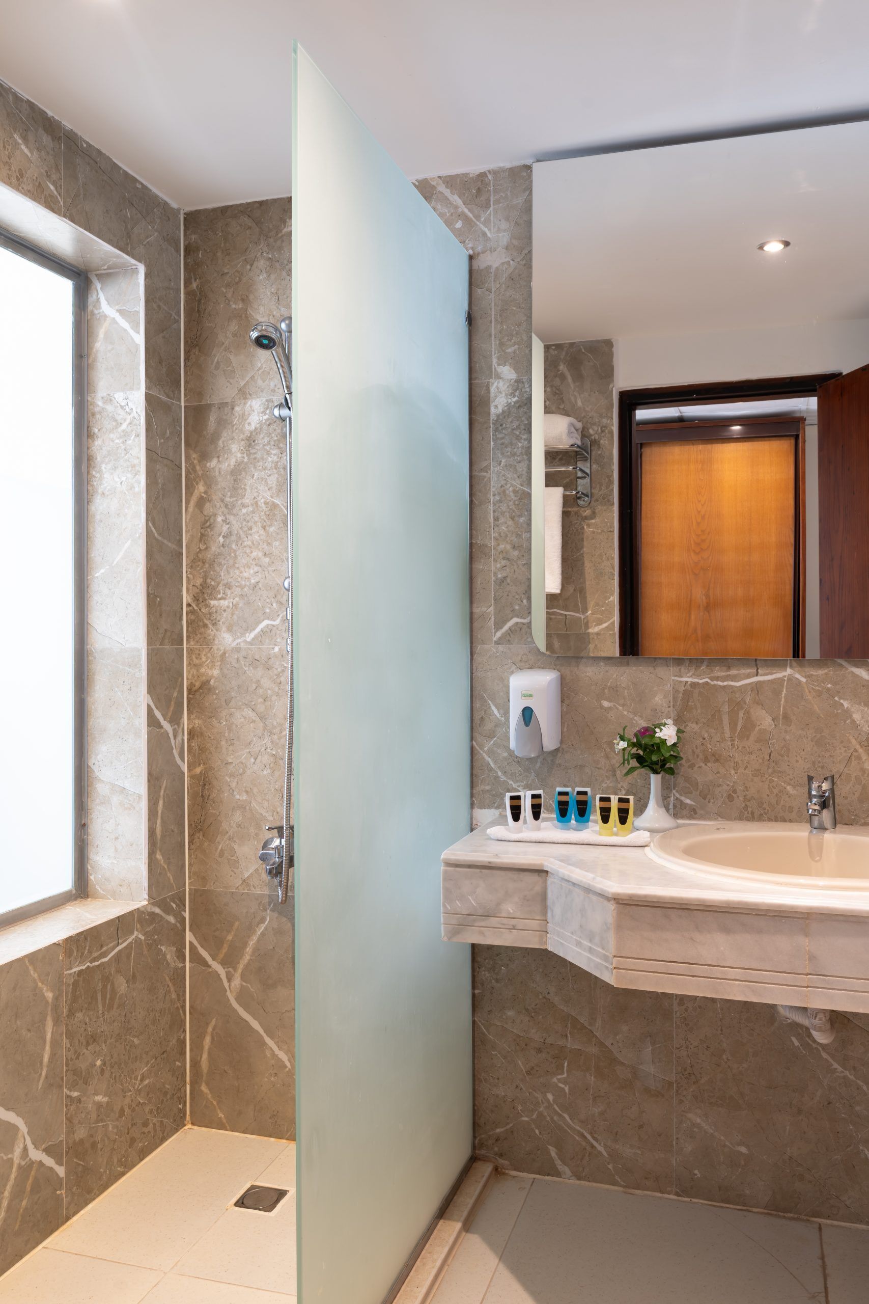 bathtub, free toiletries, hair dryer, towels