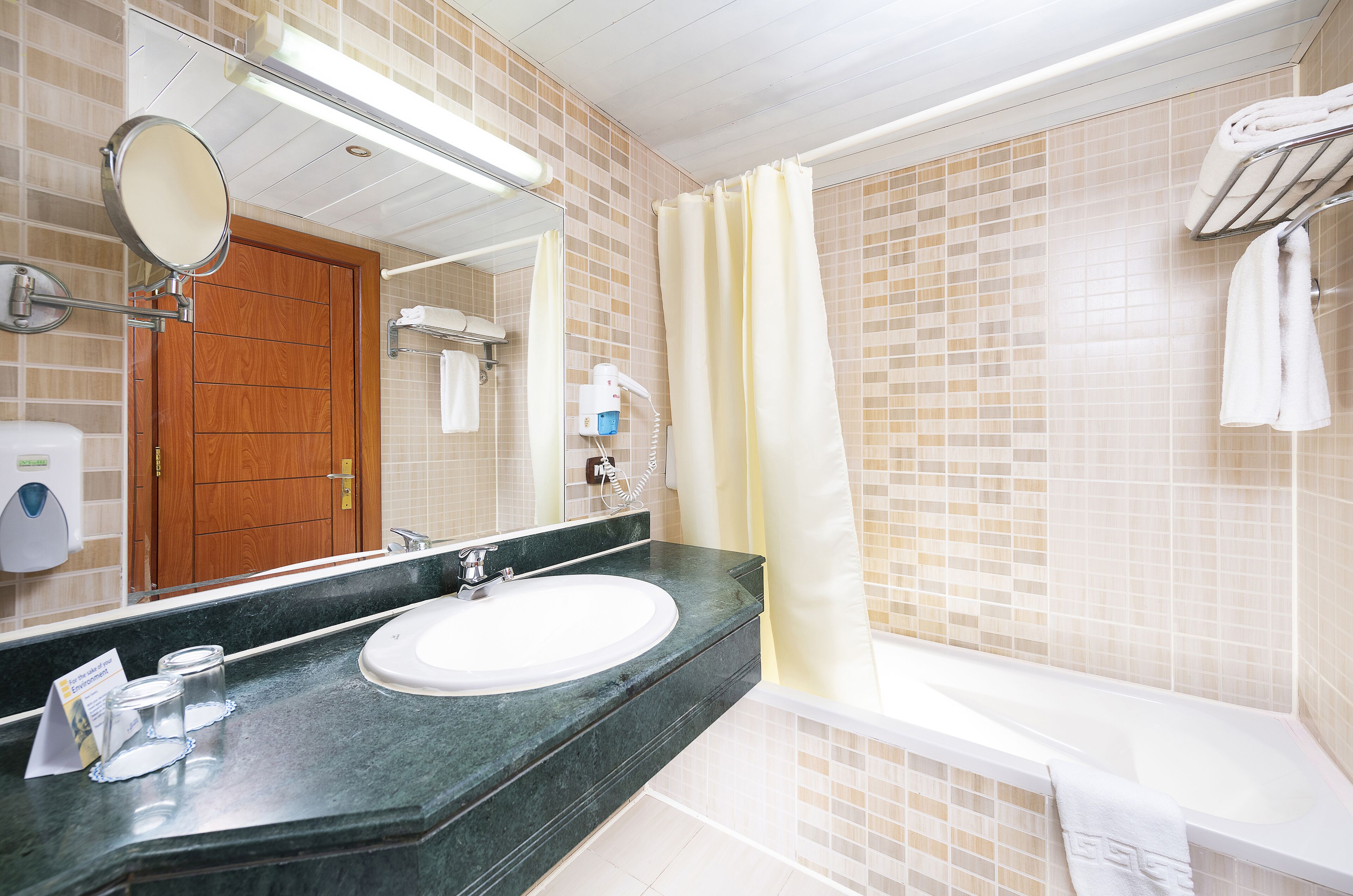 bathtub, free toiletries, hair dryer, towels