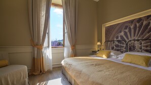 A bedroom with a large bed, a smaller bed, and a window with curtains. - La Locanda di Pietracupa (Barberino Tavarnelle)