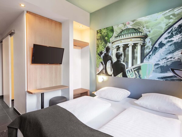 Premium bedding, pillow-top beds, desk, blackout curtains