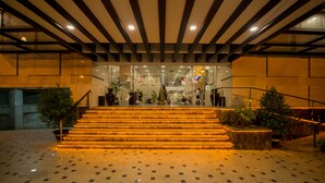 A grand staircase with a tiled floor leading to a glass entrance. - Hotel Parami (Yangon)
