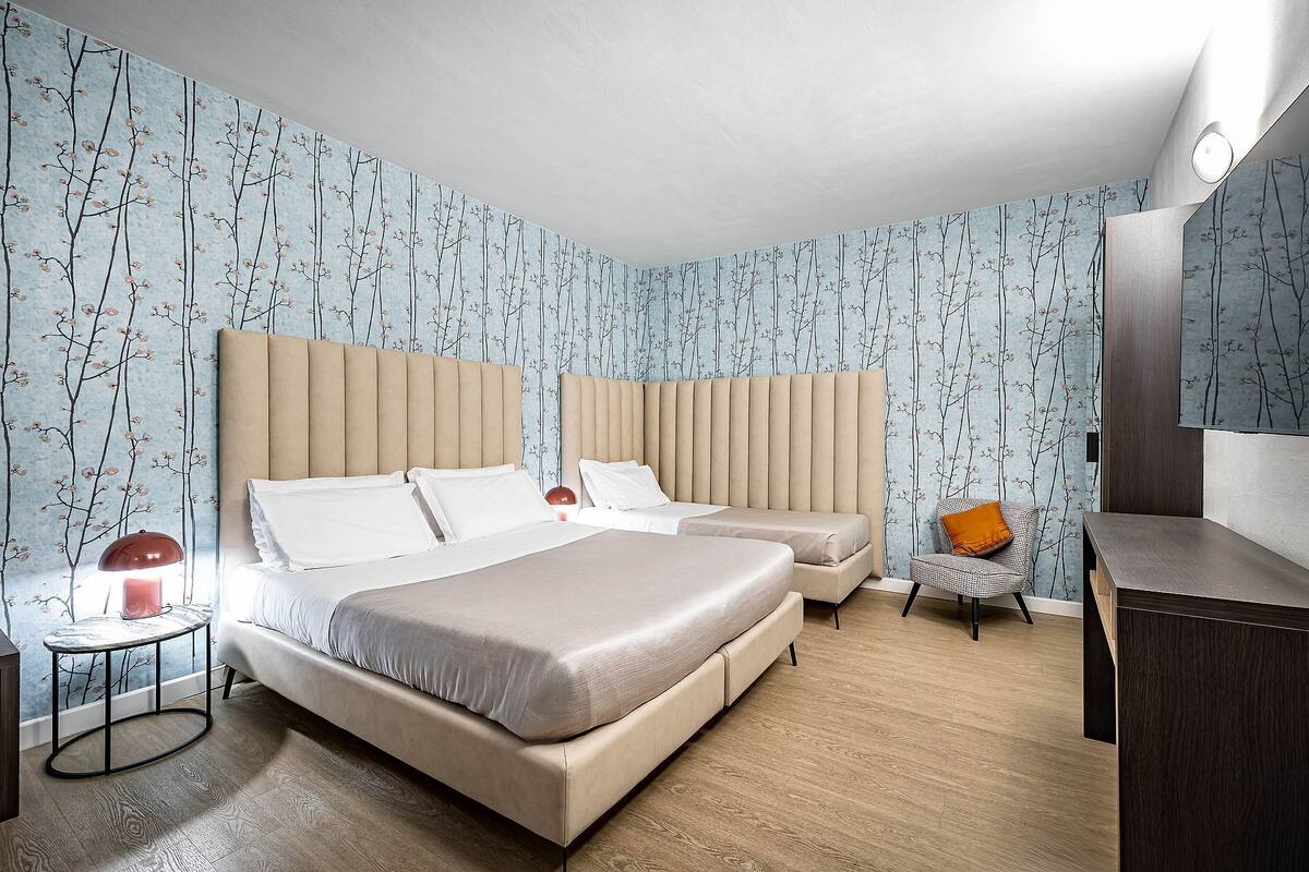 Standard Triple Room | Minibar, in-room safe, desk, blackout drapes