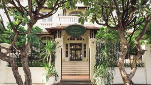 A building entrance with a sign reading "Central Mansions." - Central Mansions Hotel and Apartments (Phnom Penh)
