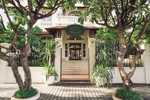 A building entrance with a sign reading "Central Mansions." - Central Mansions Hotel and Apartments (Phnom Penh)