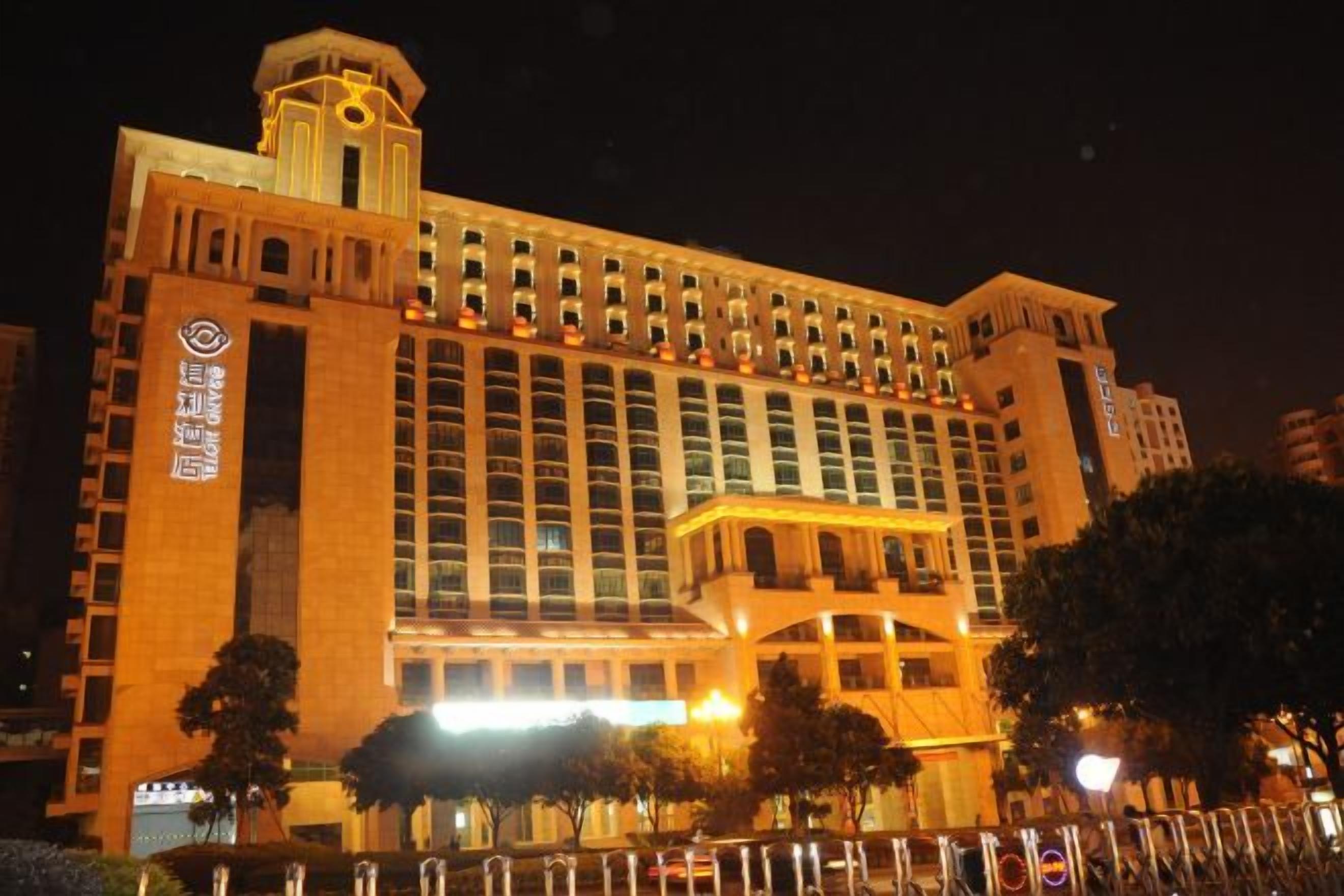 A large hotel with multiple floors and a prominent tower.