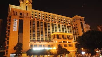 A large hotel with multiple floors and a prominent tower.