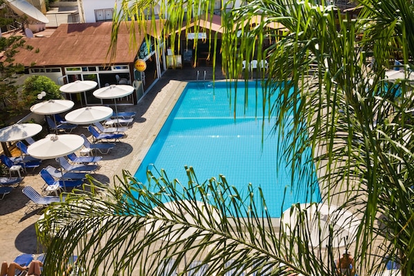 Seasonal outdoor pool, pool umbrellas, pool loungers