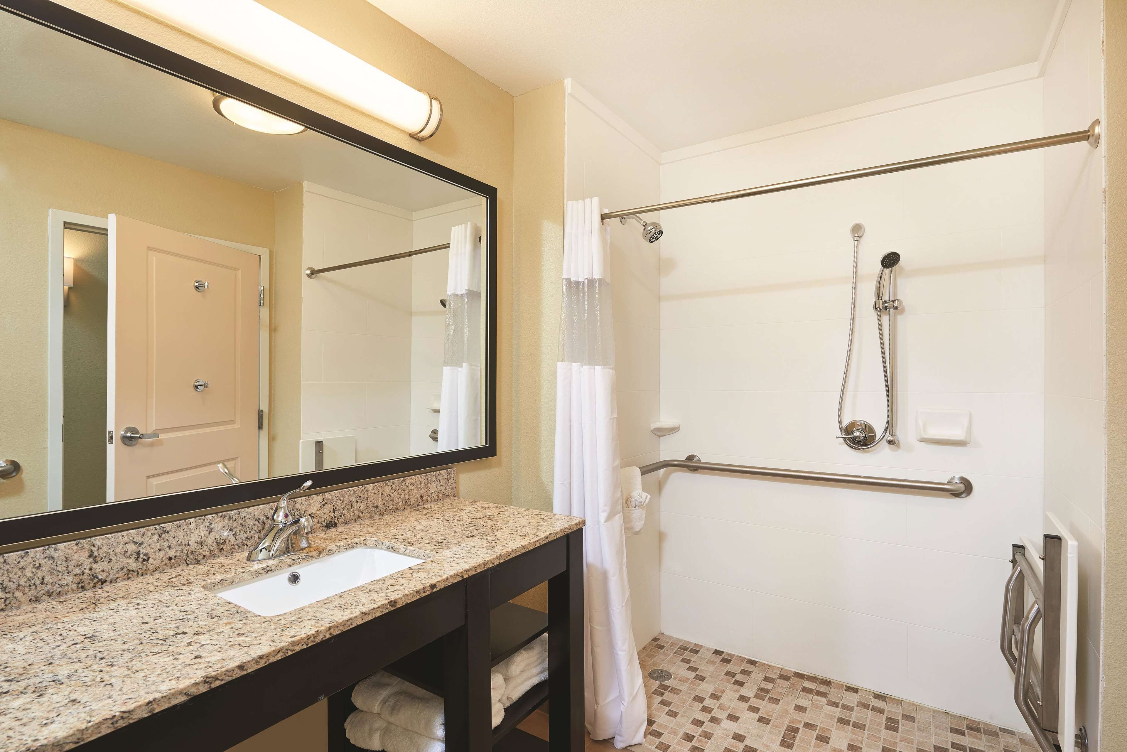 deluxe suite, 1 king bed, non smoking (mobility/hearing impaired accessible) | premium bedding, desk, iron/ironing board, free cots/infant beds