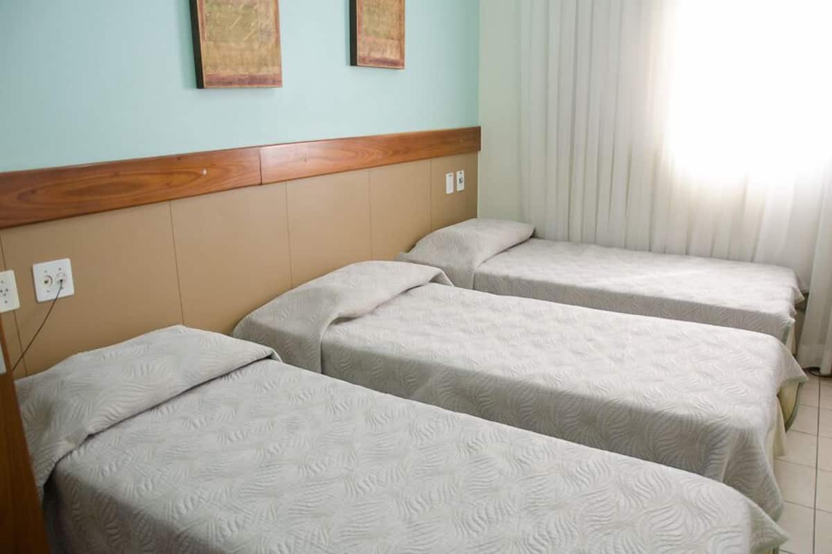Triple Room | Minibar, in-room safe, desk, blackout curtains
