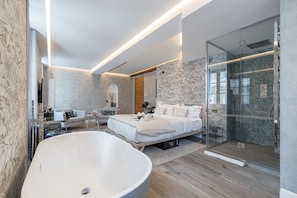Superior Suite | Minibar, in-room safe, blackout drapes, iron/ironing board