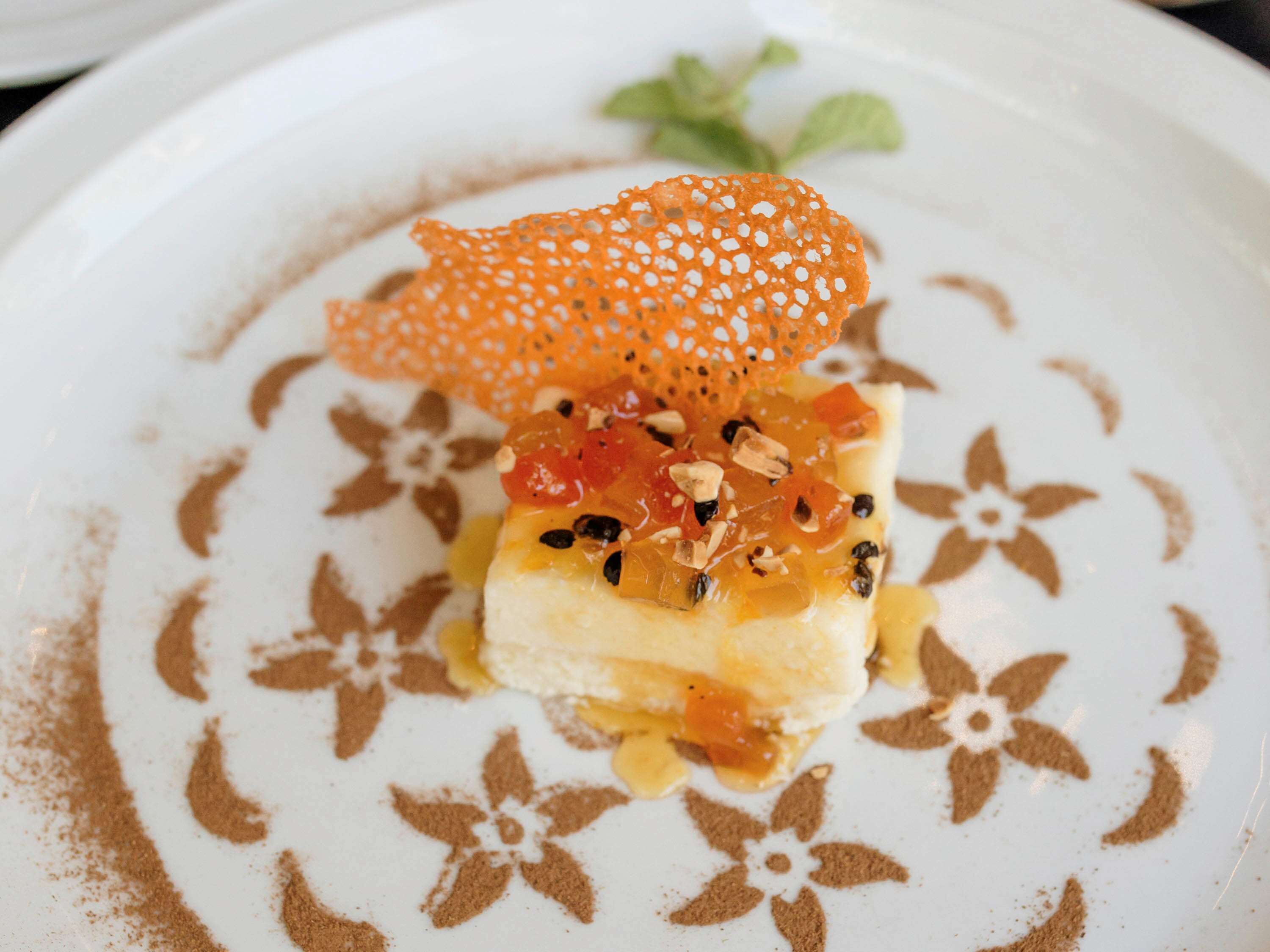 A dessert on a plate with a floral pattern.