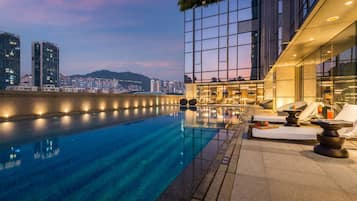 Outdoor pool, open noon to 9:00 PM, pool loungers