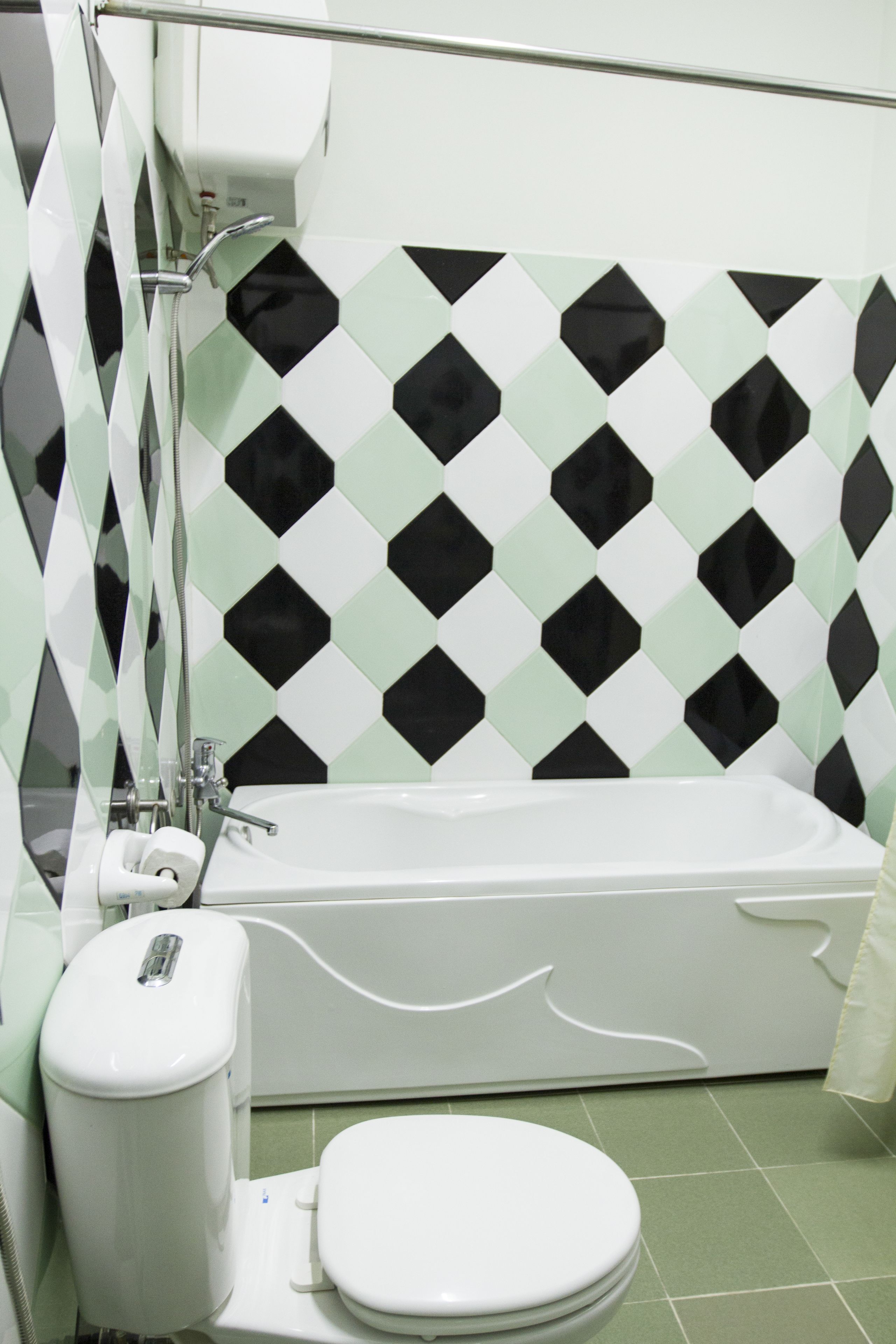 deluxe double room | bathroom | bathtub, free toiletries, hair dryer, slippers