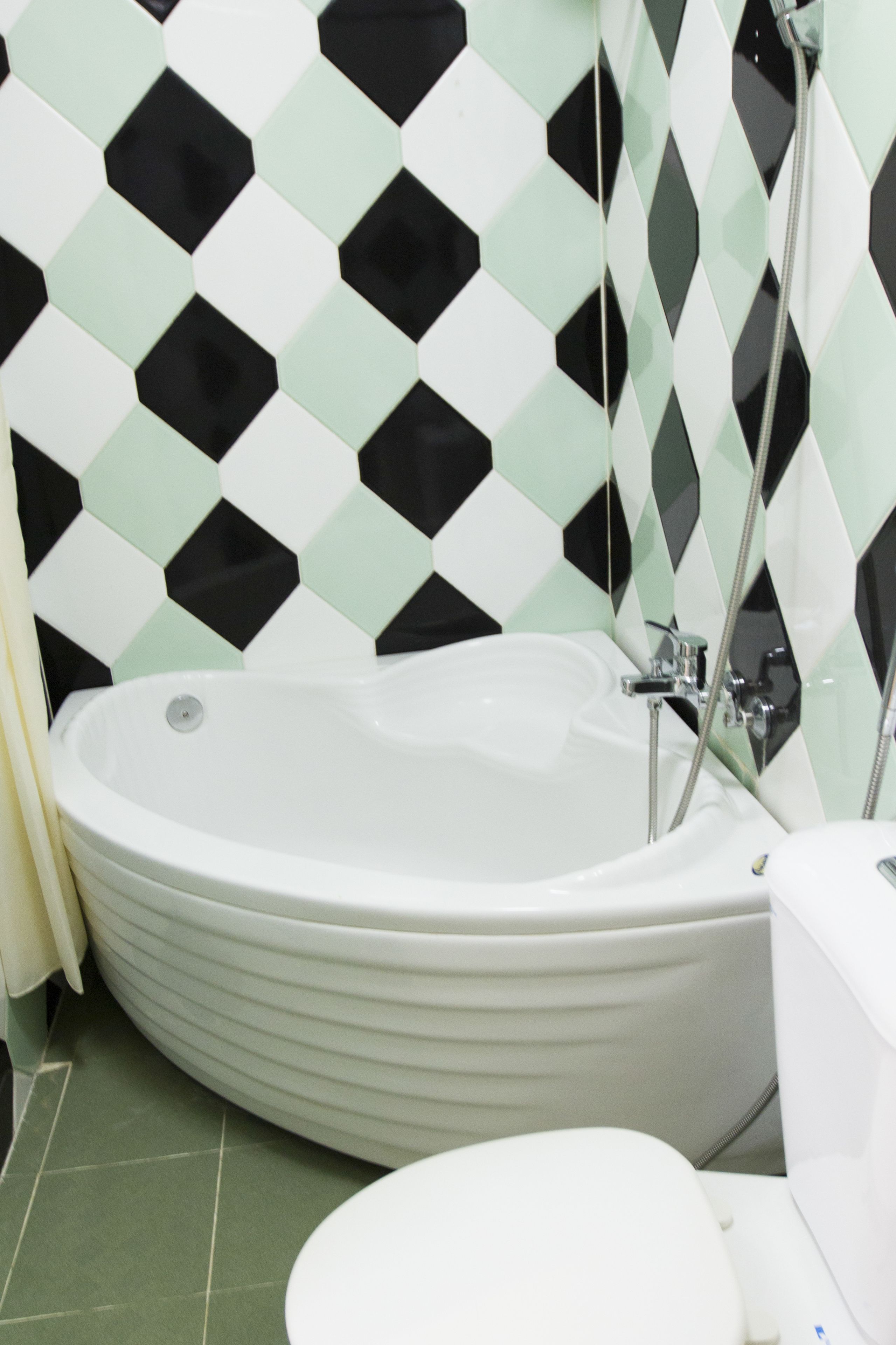 deluxe double room | bathroom | bathtub, free toiletries, hair dryer, slippers