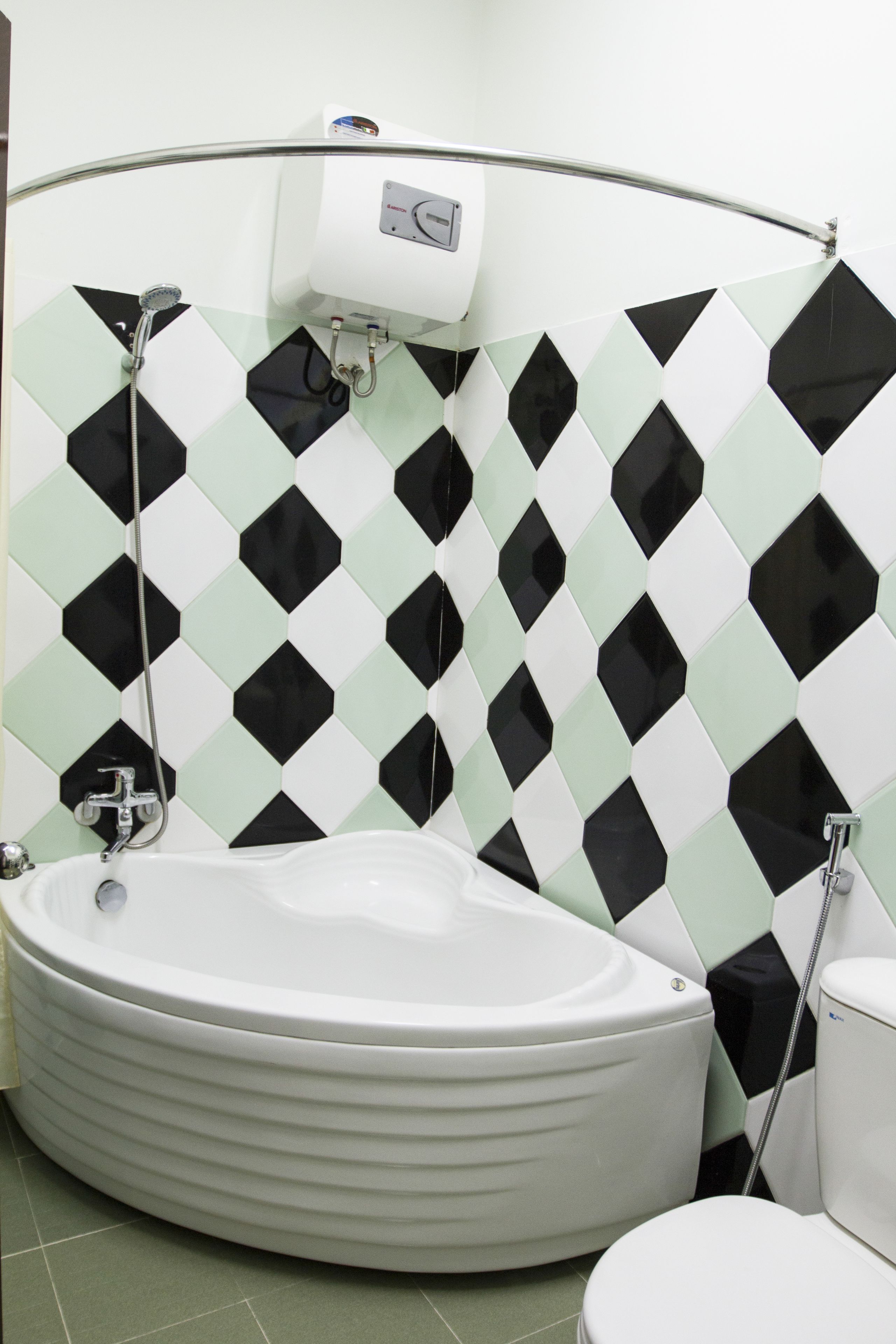 deluxe double room | bathroom | bathtub, free toiletries, hair dryer, slippers