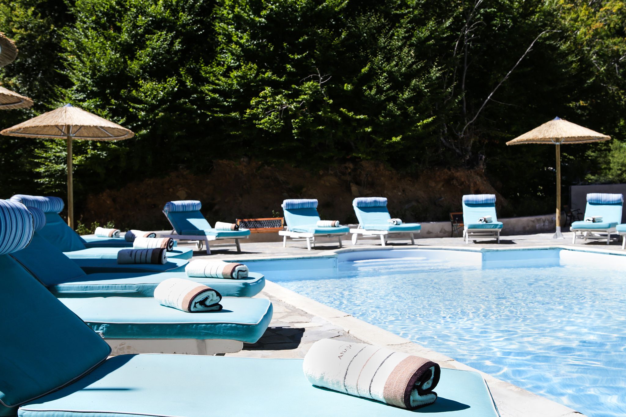 seasonal outdoor pool, open 11 am to 5:00 pm, pool umbrellas