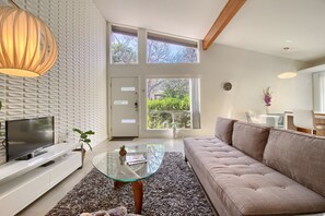Business Townhome - The Plum Door | Living area | 49-inch flat-screen TV with digital channels, Smart TV, Netflix