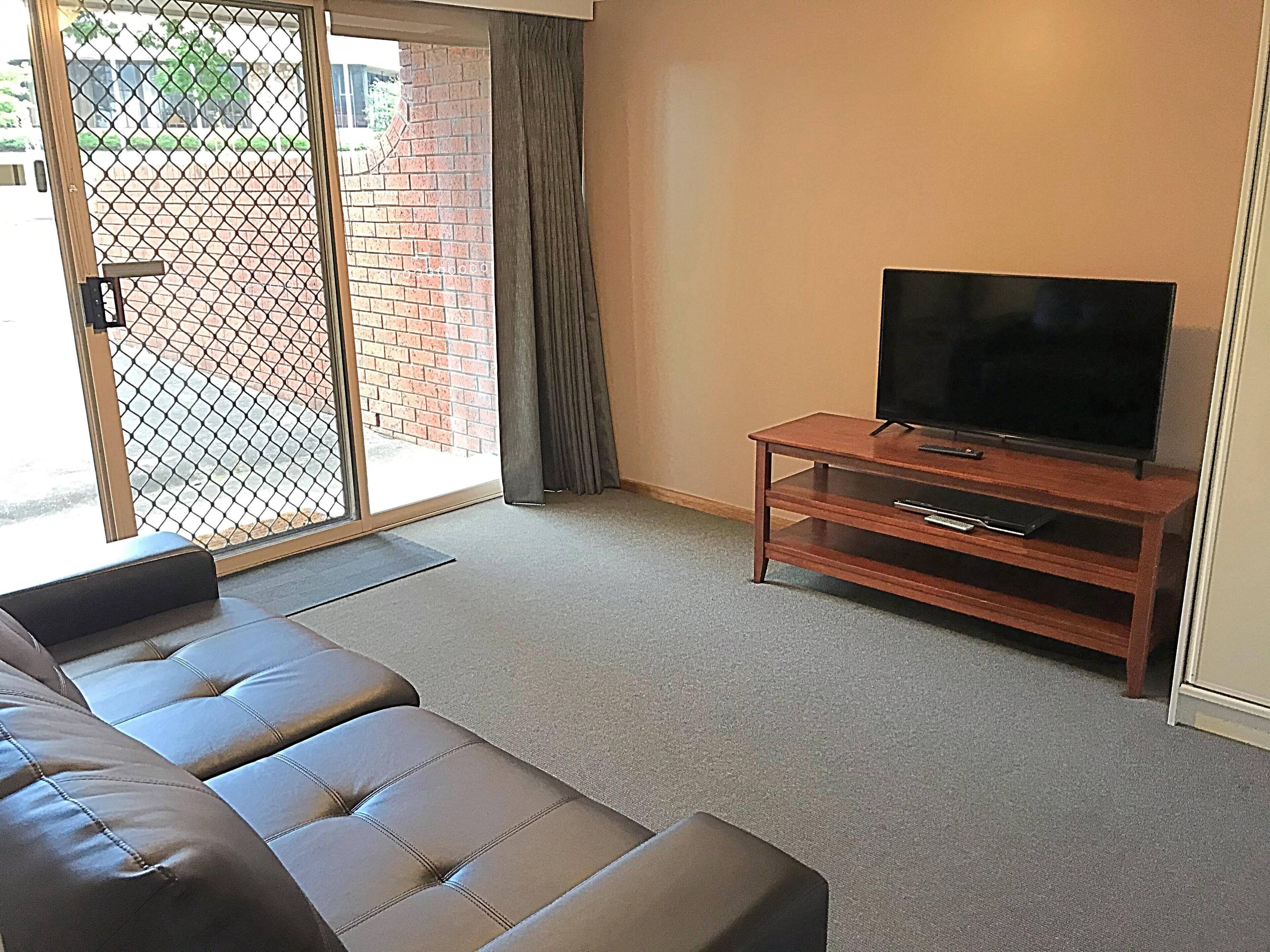 3 Bedroom Apartment | Living area | 40-inch Smart TV with digital channels, TV, Netflix