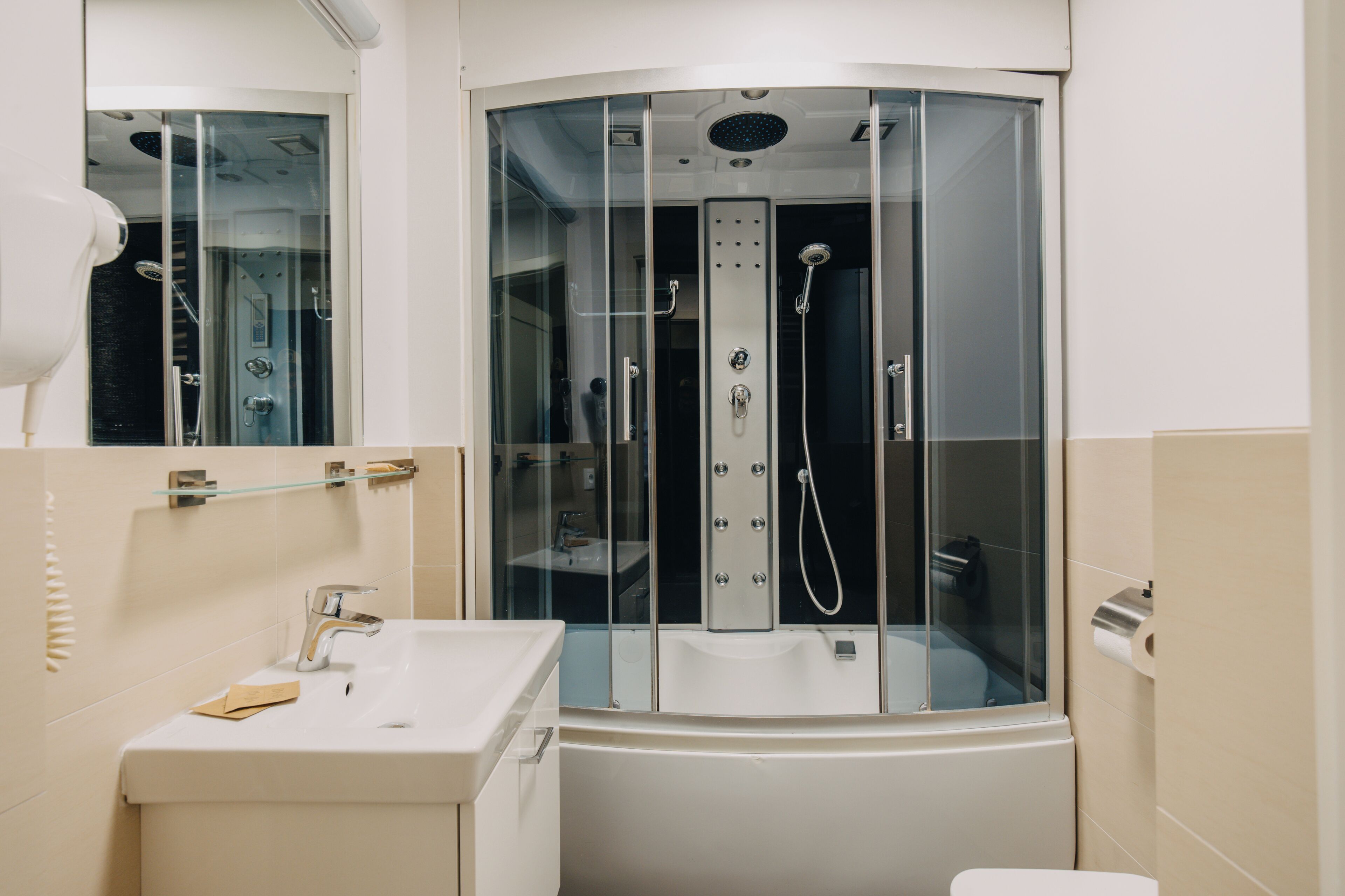 apartment | bathroom | hair dryer, towels, soap, shampoo