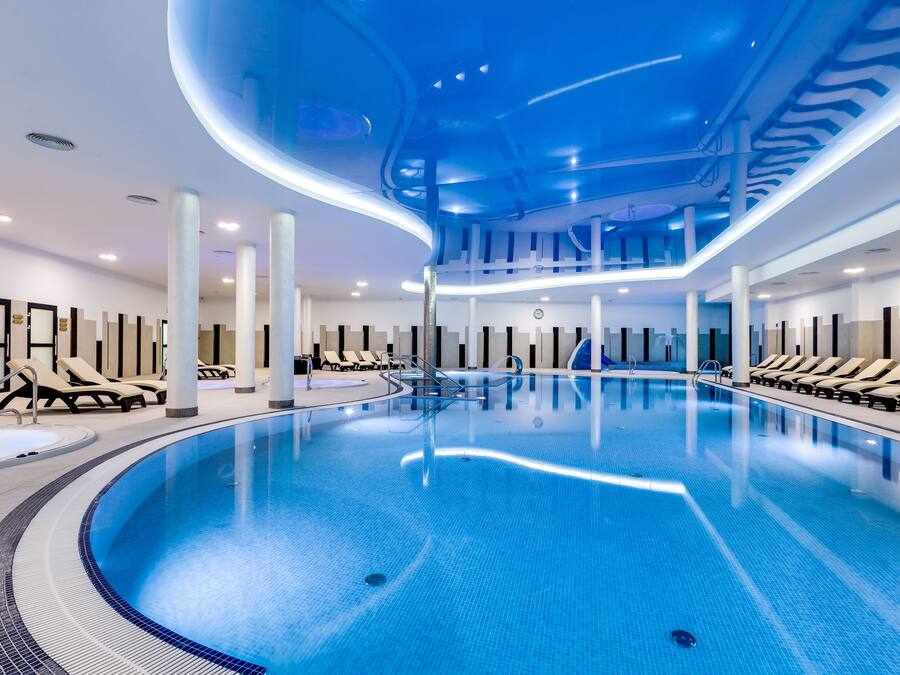 Indoor pool, outdoor pool, pool umbrellas, sun loungers