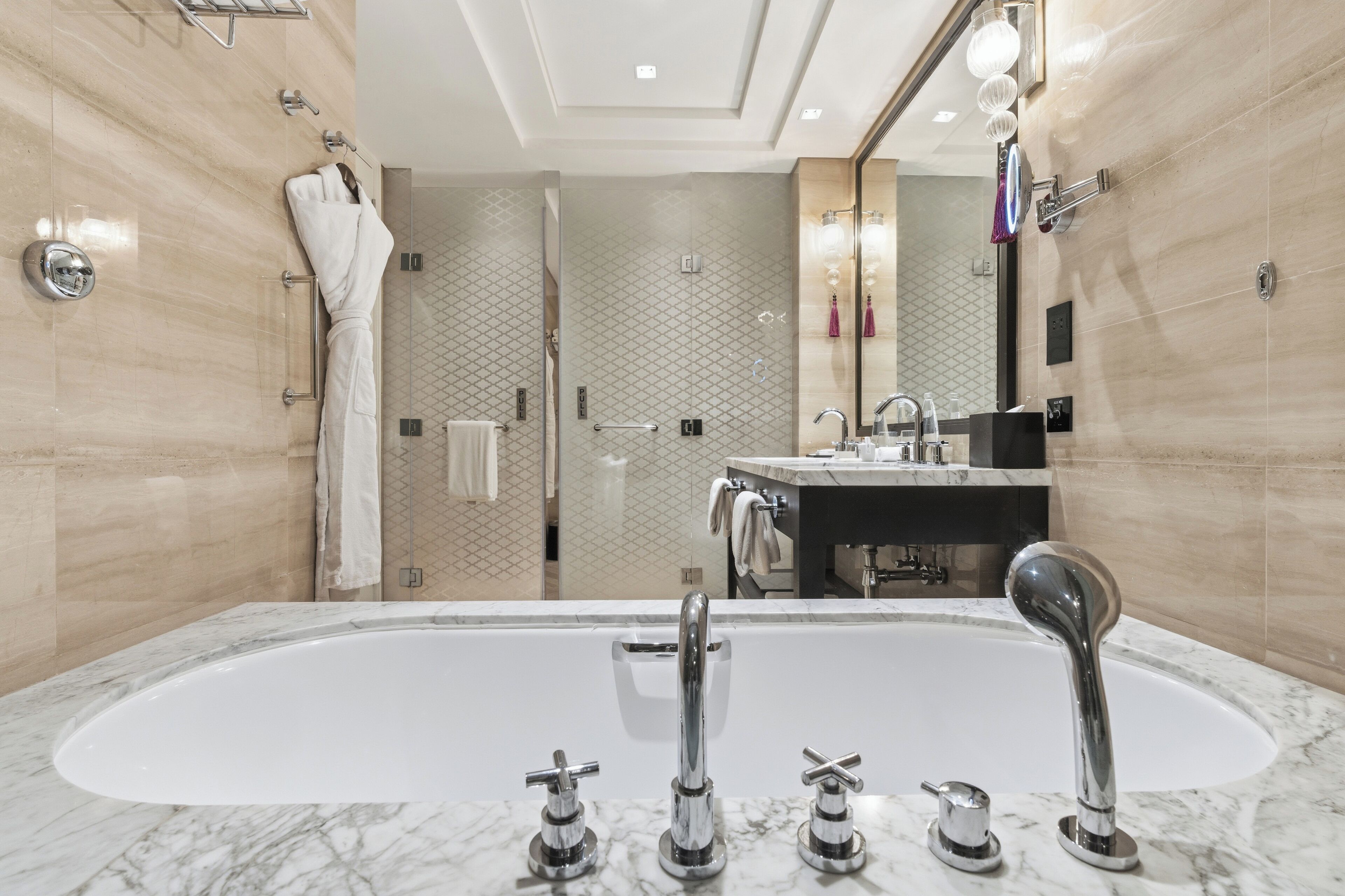 Separate bathtub and shower, deep-soaking bathtub, designer toiletries