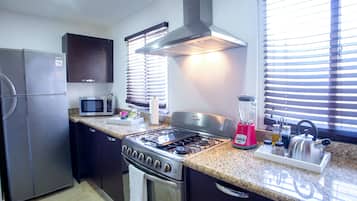 Two Bedrooms Elite Suite | Private kitchen | Full-size fridge, microwave, oven, stovetop