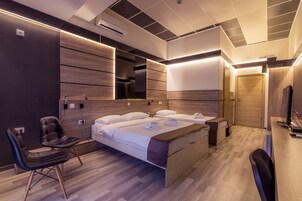 Quarto família, vista para a cidade | Lençóis italianos Frette, roupas de cama premium