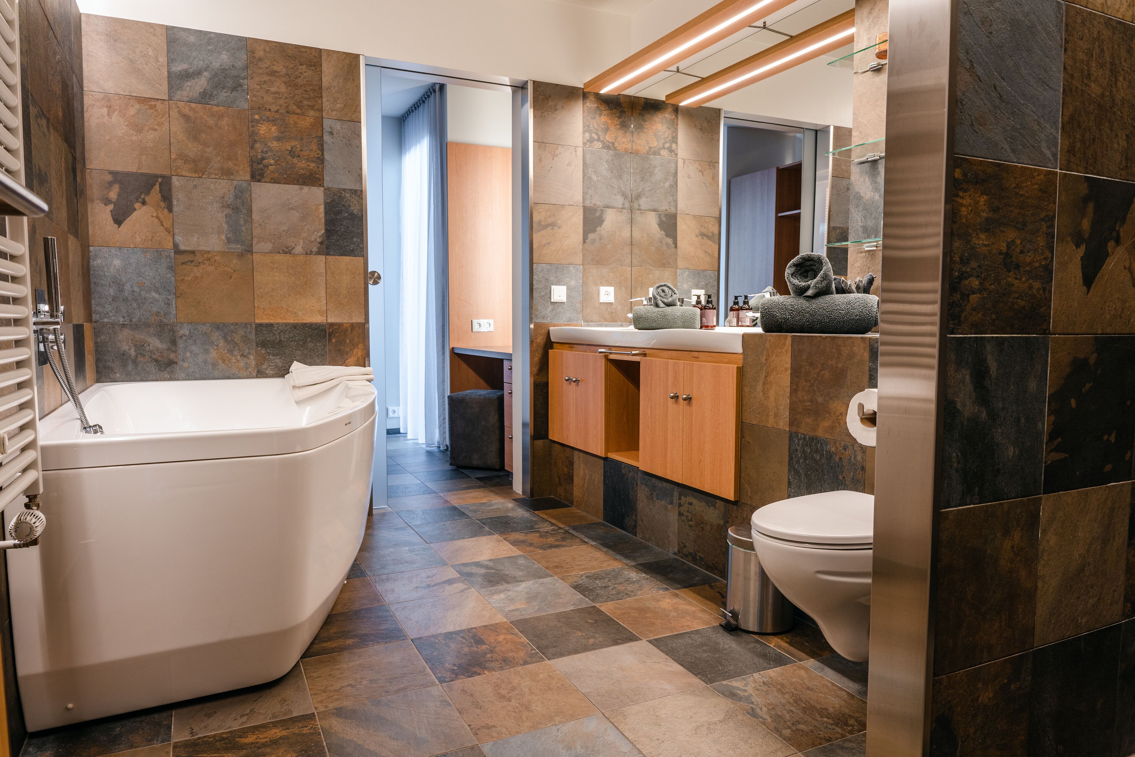 suite | bathroom | hair dryer, towels, soap, shampoo