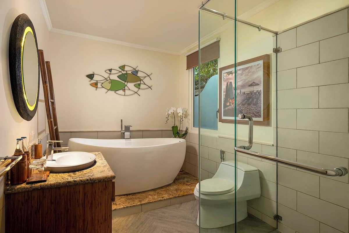 one bedroom apartment suite         | bathroom | separate bathtub and shower, rainfall showerhead, free toiletries