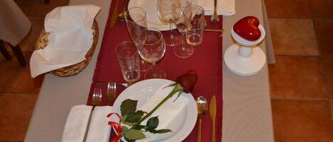 A table set for a meal with plates, glasses, and cutlery.