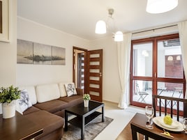 Apartamento, 1 quarto, cozinha americana (Tetmajer 1) | Sala de estar | TV de tela plana