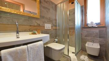 Shower, free toiletries, hair dryer, slippers