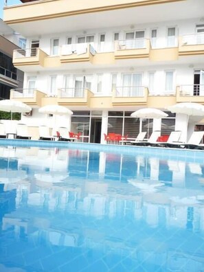 Seasonal outdoor pool, pool umbrellas, pool loungers