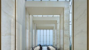 A spacious conference room with a high ceiling, large windows, and a polished marble floor. - InterContinental Bandung Dago Pakar by IHG (Cimenyan)