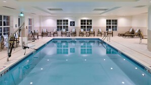 A large indoor swimming pool with lounge chairs and a sign indicating no diving. - Homewood Columbia Laurel (Laurel)