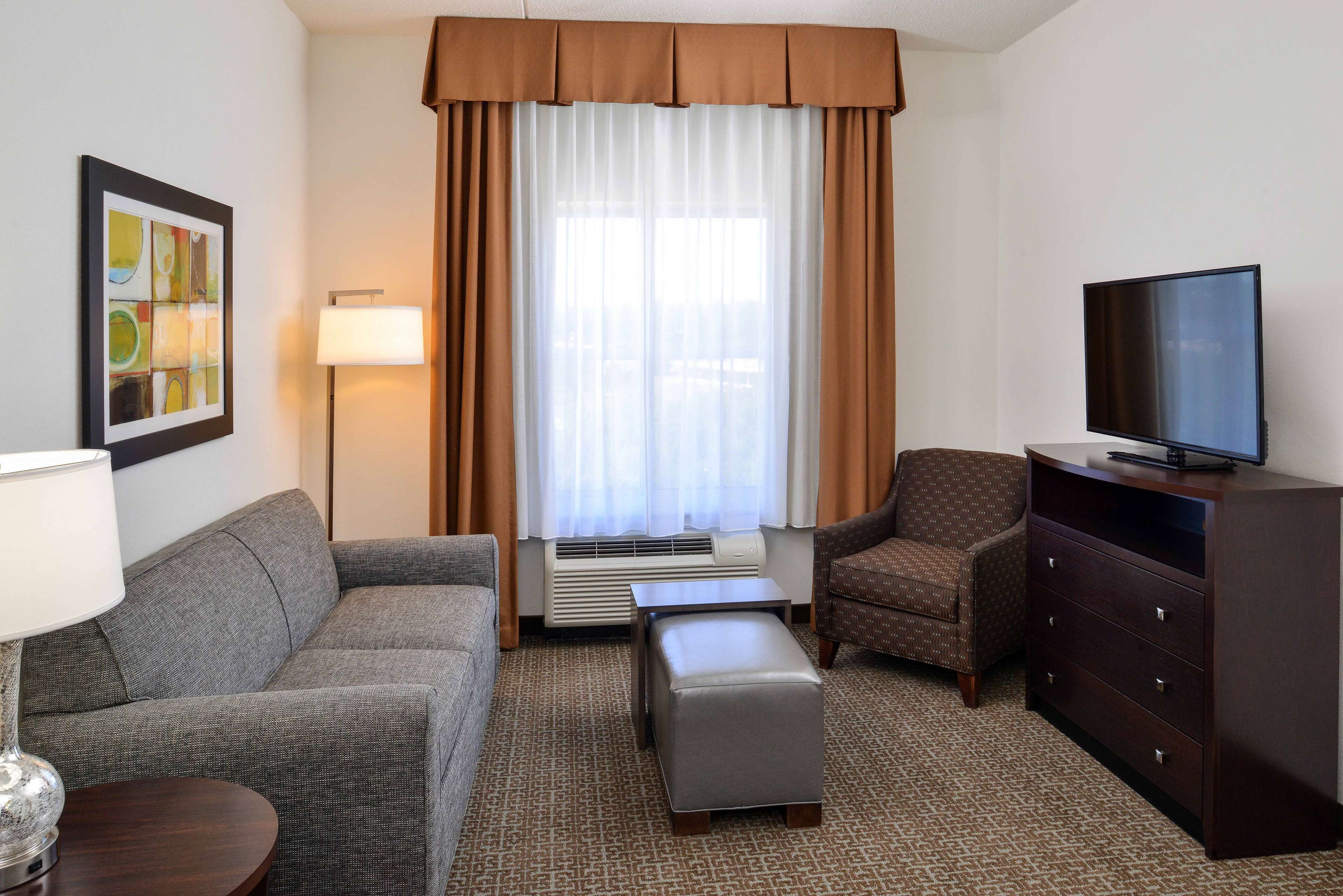 suite, 2 queen beds, non smoking | living area | 32-inch lcd tv with cable channels, tv, mp3 dock