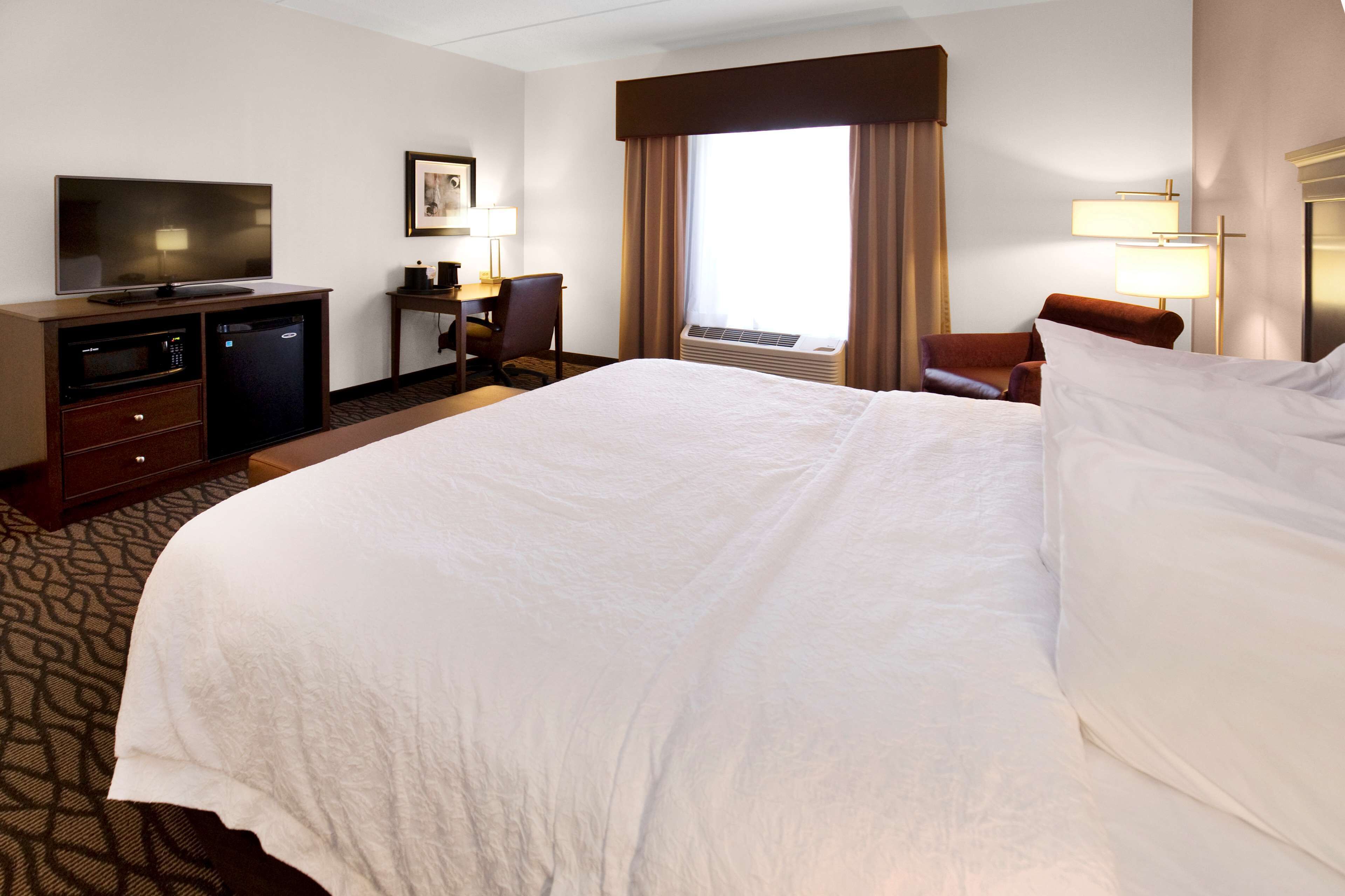 premium bedding, desk, blackout curtains, iron/ironing board