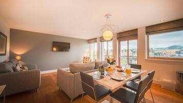 Deluxe Apartment, 2 Bedrooms, 2 Bathrooms, River View | Living area | Flat-screen TV