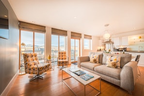 Deluxe Apartment, 2 Bedrooms, 2 Bathrooms, River View | Living area | Flat-screen TV
