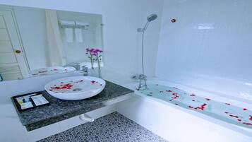 Deluxe Room | Bathroom | Hair dryer, slippers, towels