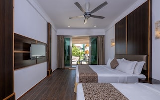 Family Room | Down comforters, minibar, in-room safe, individually decorated