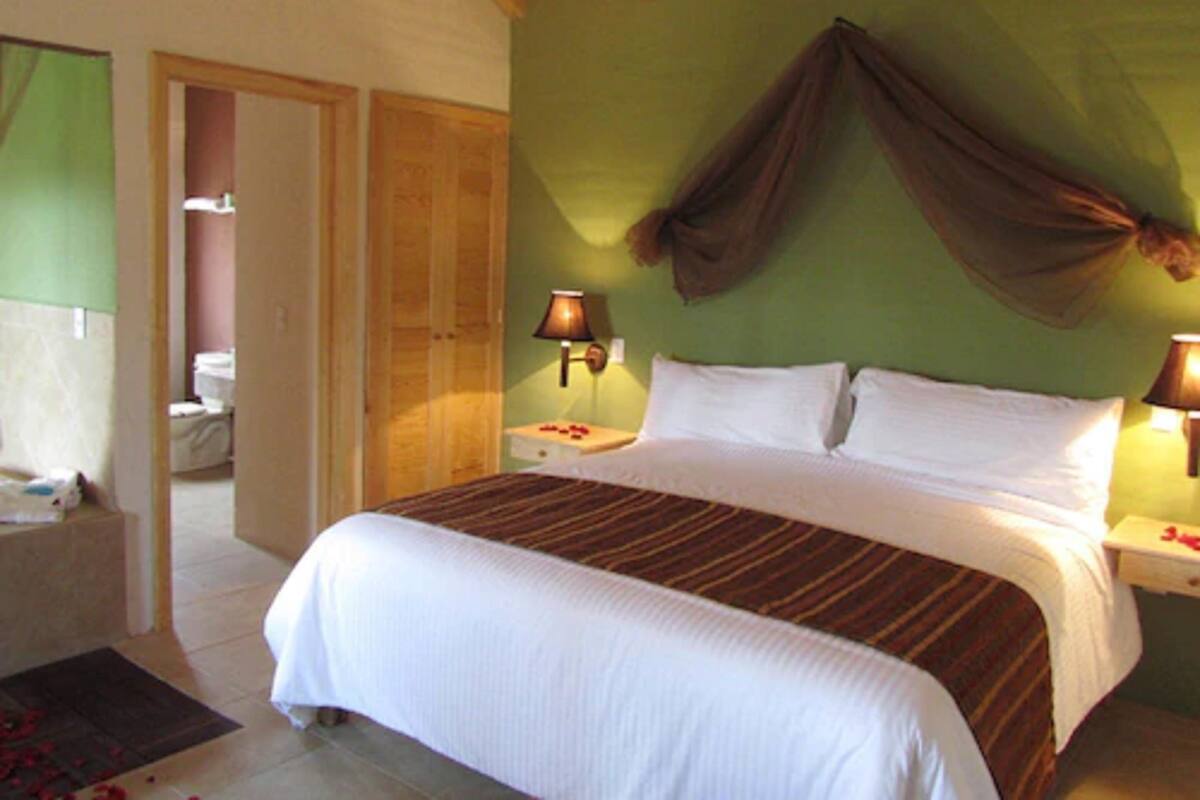Romantic Suite, 1 King Bed, Jetted Tub | Premium bedding, in-room safe, laptop workspace, individually decorated