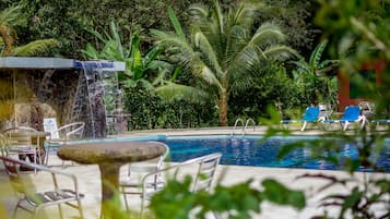 Outdoor pool, open 8:00 AM to 10:00 PM, pool loungers