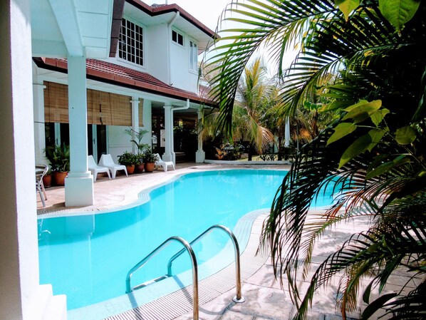 Outdoor pool, pool umbrellas, pool loungers