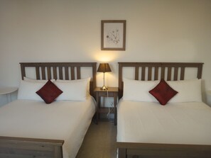 Family Room, 2 Queen Beds | Bathroom | Shower, hair dryer, towels