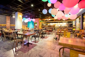 Enjoy a casual dining experience with a variety of seating options and a lively atmosphere.