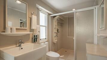 Shower, hair dryer, slippers, towels