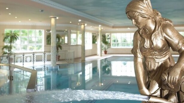 A statue of a woman by a pool in a hotel lobby. - Wolseley Holiday Lodges (Tullow)